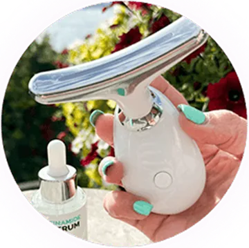 Hand holding the device next to a serum bottle
